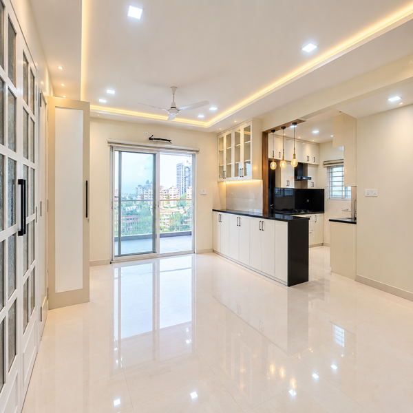Modern kitchen, modular kitchen, luxury kitchen, contemporary kitchen design, white kitchen cabinets, black granite countertop, kitchen island, breakfast counter, pendant lights, glass cabinets, spacious kitchen, premium interiors, modern apartment kitchen, elegant kitchen, stylish cabinetry, black countertop, built-in storage, warm LED lighting, modern appliances, sleek kitchen design, glossy flooring, minimalist kitchen, contemporary home, luxury apartment, open kitchen, functional kitchen, premium kitchen interior, stylish home, sophisticated design, modern Indian kitchen, kitchen storage cabinets, decorative lighting, pendant lighting, clean kitchen, spacious cooking area, upscale home interior, modern residential design, elegant cabinetry, polished floor, high-end kitchen, contemporary architecture, beautiful kitchen interior, practical kitchen layout, luxury home design, refined interiors, premium apartment design, bright kitchen, modern lifestyle, stylish kitchen decor, designer modular kitchen, elegant residential property.